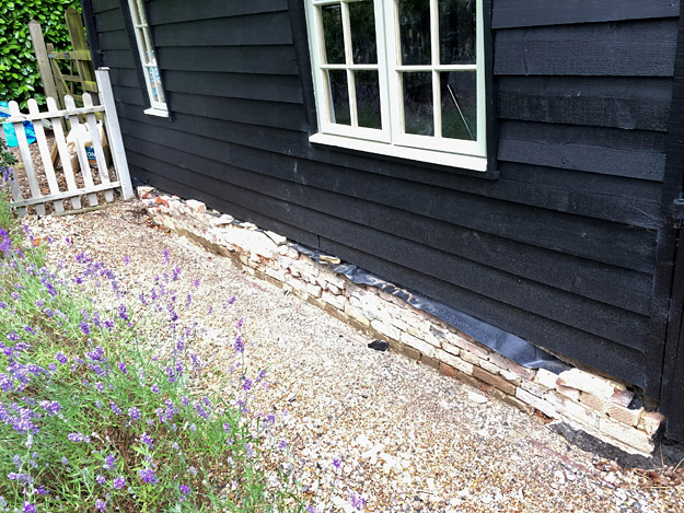 Failed cement render was removed from the plinth